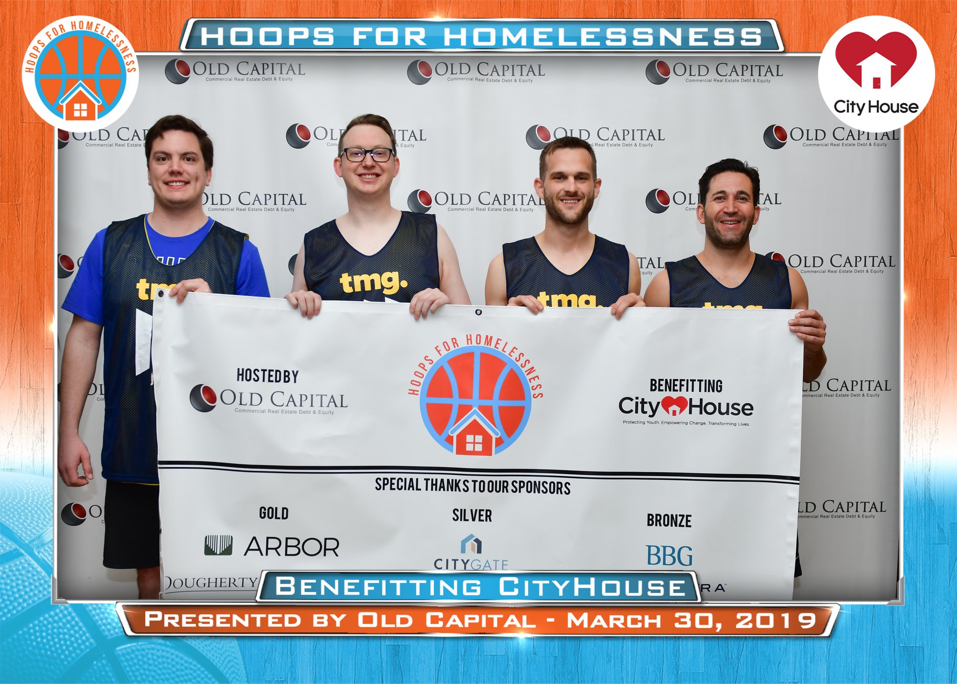 TMG members taking a picture for Hoops for Homeless by Old Capital.
